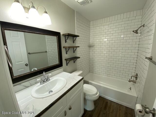 5401 Flint Road Cocoa, FL 32927 - Photo 8 of 13 a bathroom with a sink toilet tub and shower