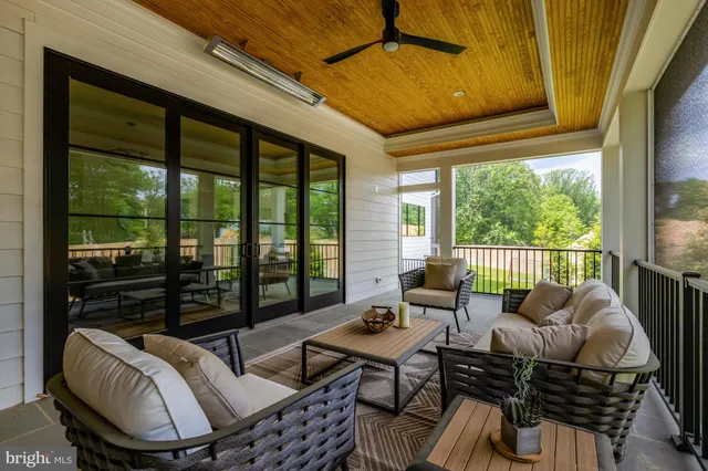 a kitchen with a stove a window and wooden floor