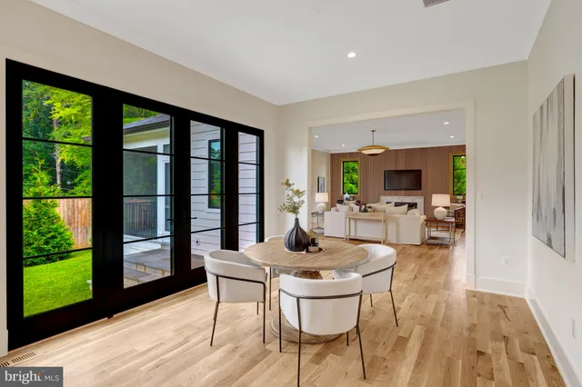 a kitchen with kitchen island a sink stove and wooden floor