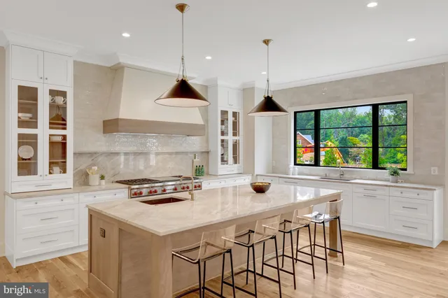 a kitchen that has a lot of cabinets in it