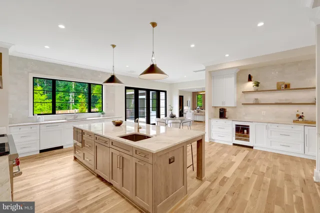 a kitchen with a stove a sink and a refrigerator