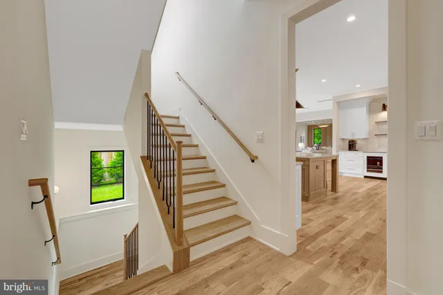 a bedroom with a large bed and a large window