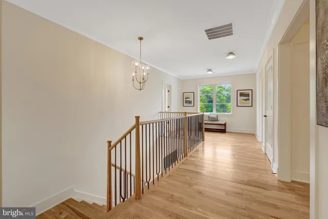 a view of kitchen with white cabinets and sink