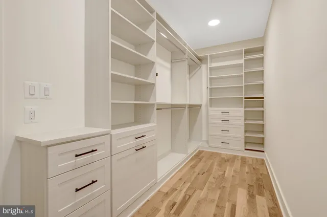a bathroom with a sink toilet vanity and bathtub