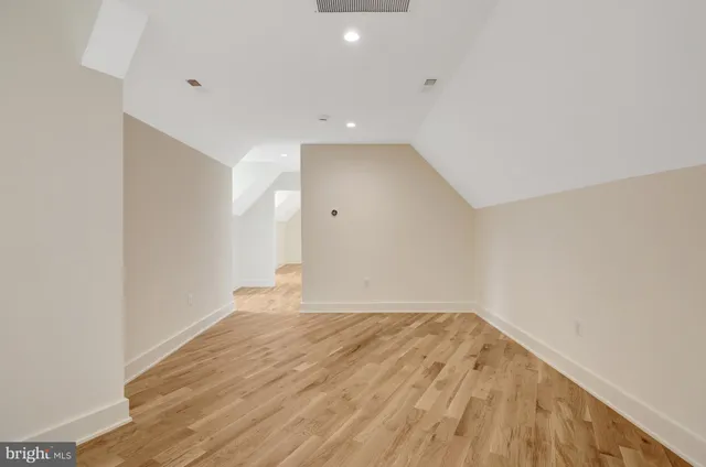 a bathroom with a sink toilet vanity and shower