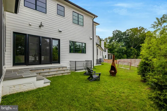 a view of a hallway with wooden floor and entryway