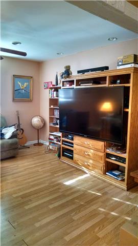 1120 Blake Road Lyles, TN 37098 - Photo 12 of 20 Lower level Family Room ~ Laminate wood floors (low up-keep, easy clean) ~ Double windows ~ Ceiling Fan ~ Open flow with Kitchen area