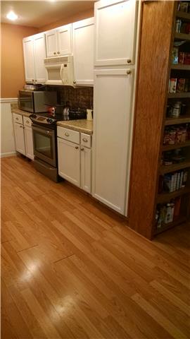 1120 Blake Road Lyles, TN 37098 - Photo 13 of 20 Large galley kitchen ~ Appliances remain ~ TONS of cabinets & working space!