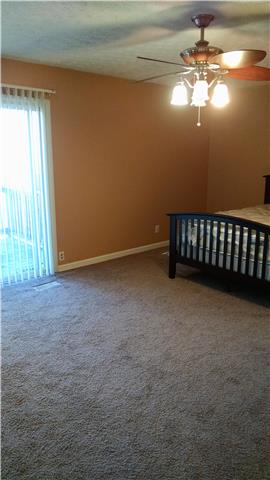 1120 Blake Road Lyles, TN 37098 - Photo 6 of 20 Master Bedroom on Main Level ~ In Suite Bath ~ PRIVATE Patio ~ Updated ceiling fan & neutral paint colors