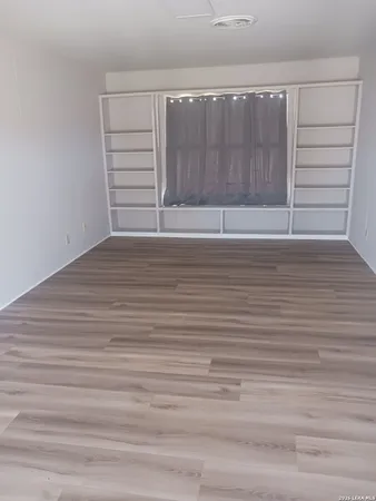 a bathroom with a toilet sink and window