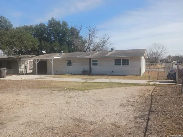 a view of yard covered with snow in the background