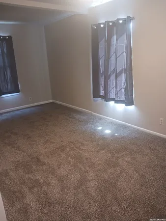 a view of a closet with wooden floor