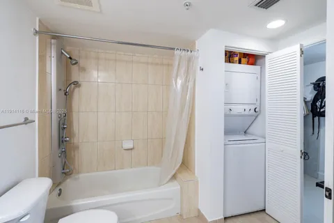 a bathroom with a shower and a toilet