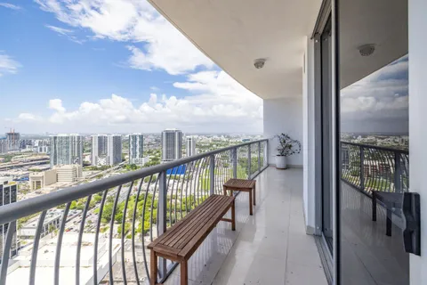 a view of a balcony with furniture