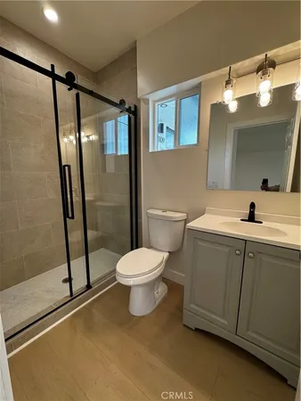 a bathroom with a toilet sink and shower