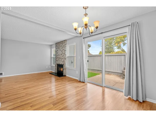 a view interior with kitchen island stainless steel appliances refrigerator and stove