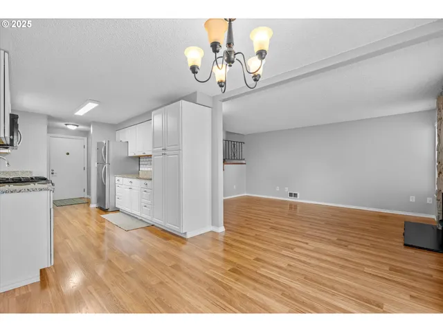 a view of empty room with a fireplace