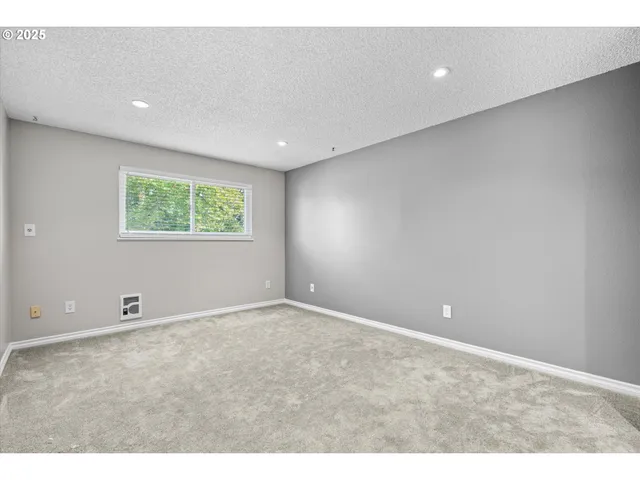 a view of a backyard with wooden fence