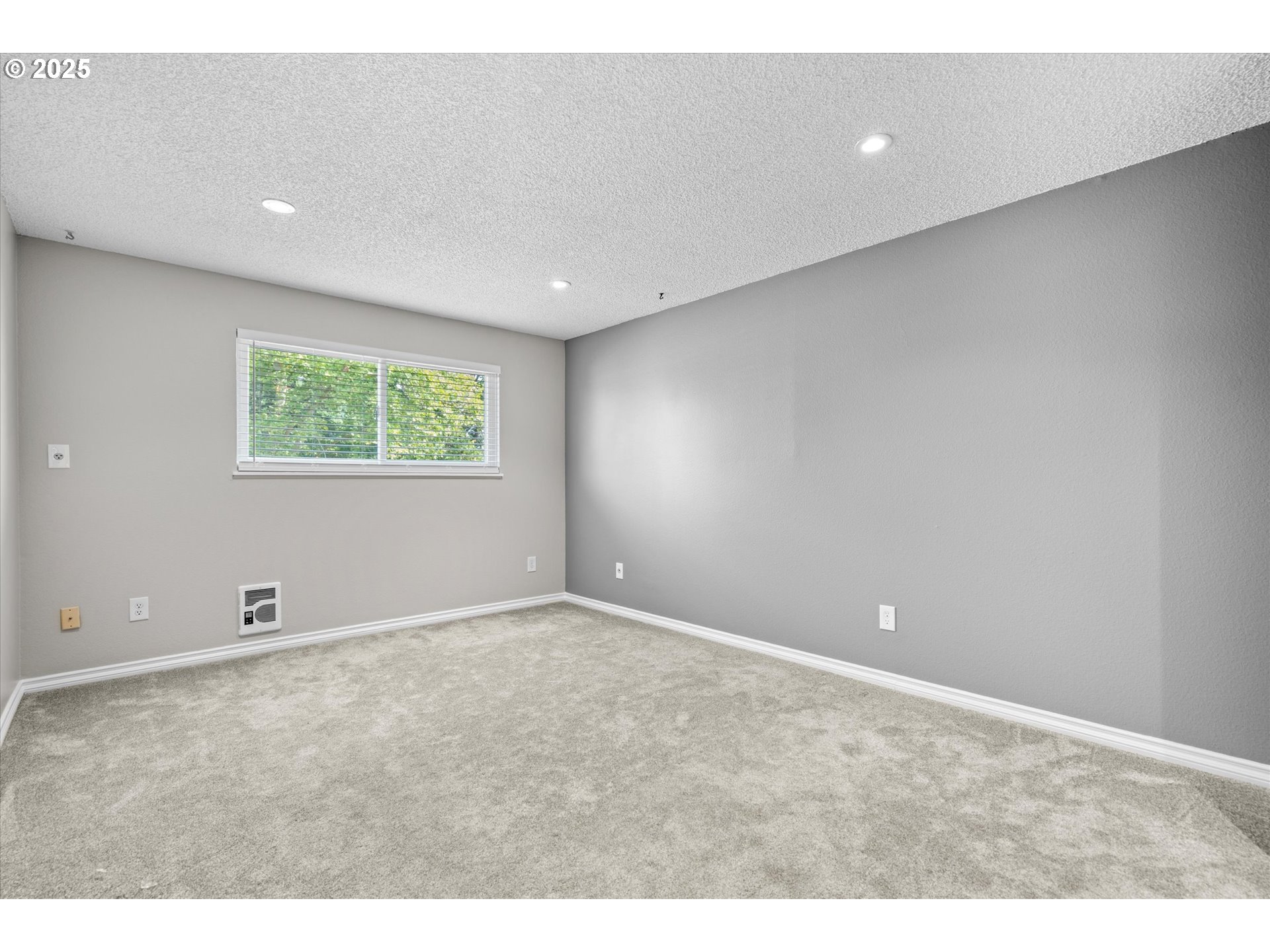 827 Northeast 90th Avenue Portland, OR 97220 - Photo 27 of 38 a view of an empty room with wooden floor and a window