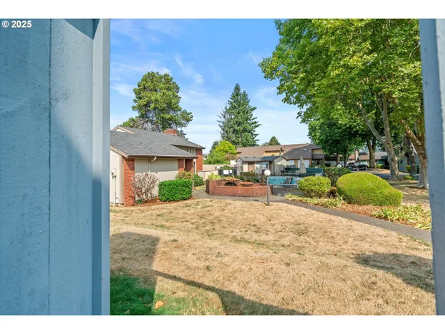 a view of a backyard of the house