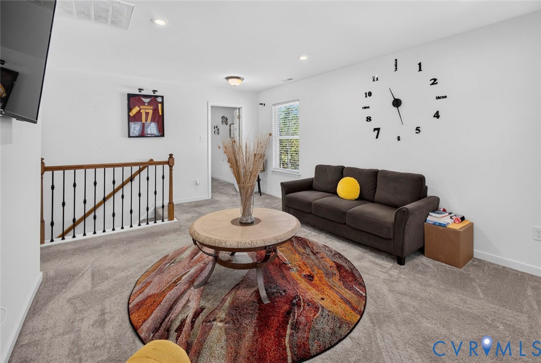 7507 Rouseaux Circle Chesterfield, VA 23832 - Photo 18 of 37 Open-concept living area featuring warm wood-finis