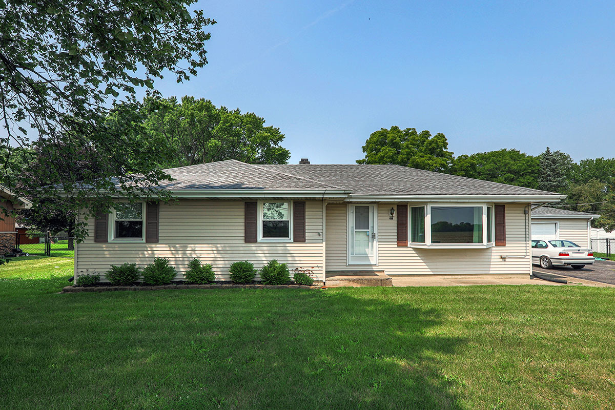 815 Bronk Road Joliet, IL 60404 - Photo 1 of 23 a front view of house with yard and green space