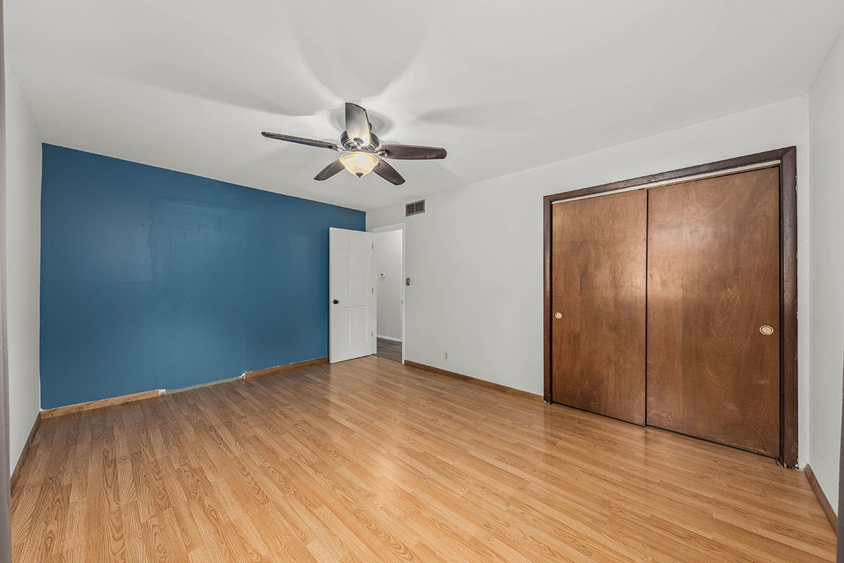 815 Bronk Road Joliet, IL 60404 - Photo 11 of 23 a view of an empty room with wooden floor
