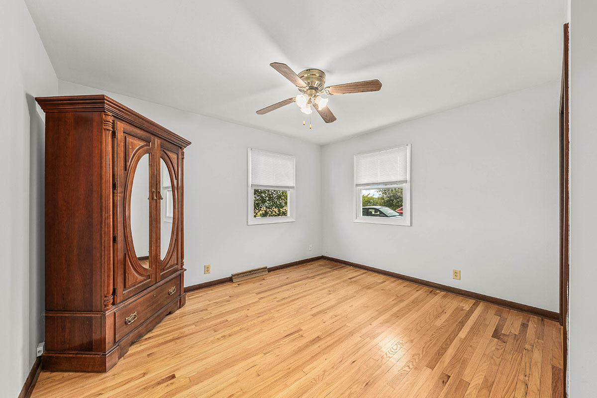 815 Bronk Road Joliet, IL 60404 - Photo 12 of 23 wooden floor in an empty room with a window