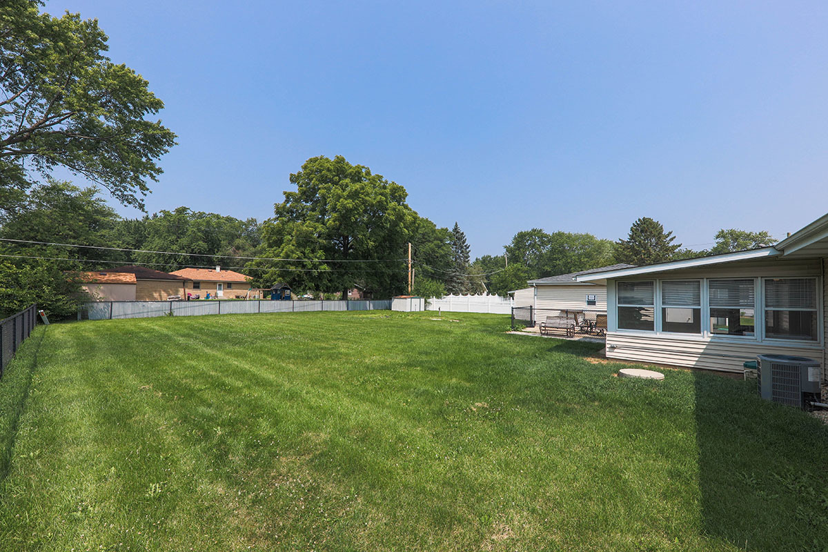 815 Bronk Road Joliet, IL 60404 - Photo 22 of 23 a view of a house with a big yard