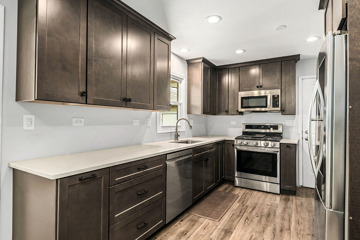 815 Bronk Road Joliet, IL 60404 - Photo 6 of 23 a kitchen with stainless steel appliances granite countertop a sink a stove and cabinets