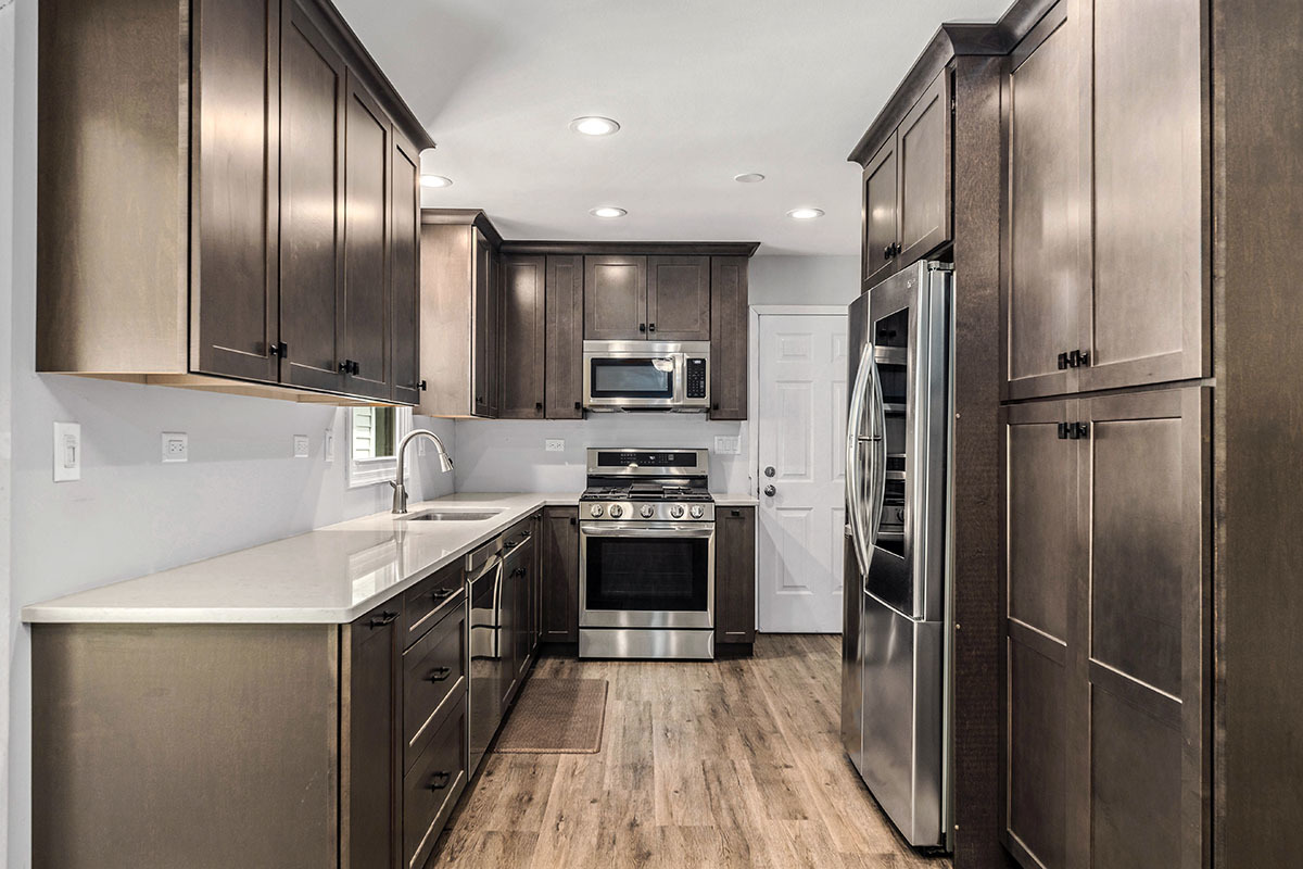 815 Bronk Road Joliet, IL 60404 - Photo 7 of 23 a kitchen with stainless steel appliances granite countertop a stove a refrigerator and a sink