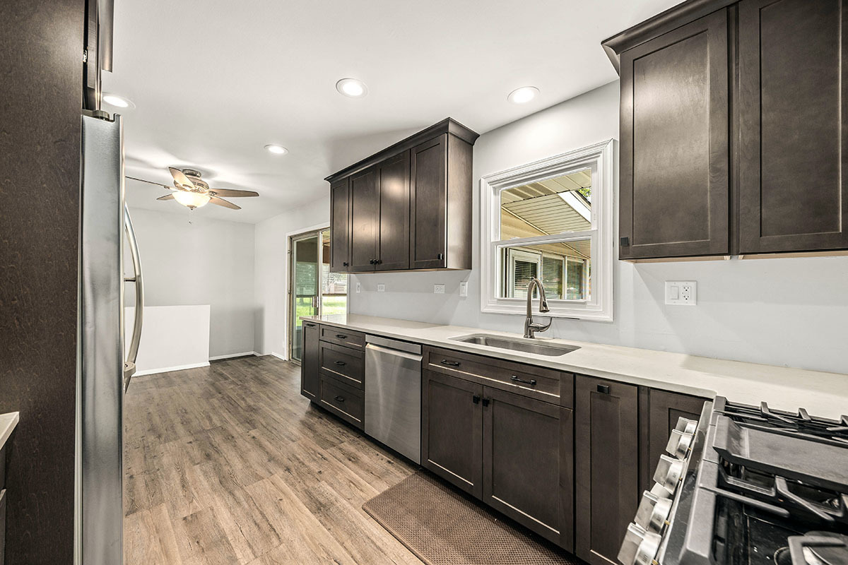 815 Bronk Road Joliet, IL 60404 - Photo 8 of 23 a kitchen with stainless steel appliances a sink stove and cabinets