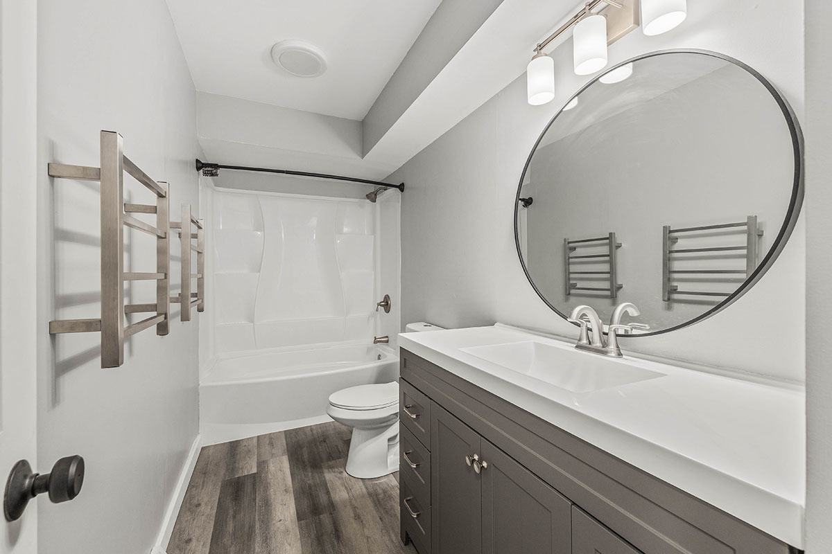 815 Bronk Road Joliet, IL 60404 - Photo 9 of 23 a bathroom with a sink a toilet and a mirror