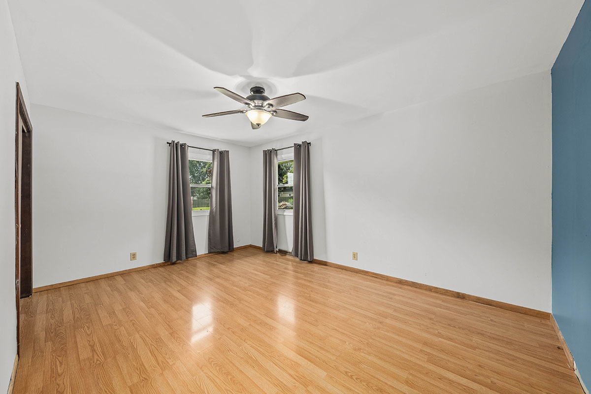 815 Bronk Road Joliet, IL 60404 - Photo 10 of 23 a view of an empty room with wooden floor