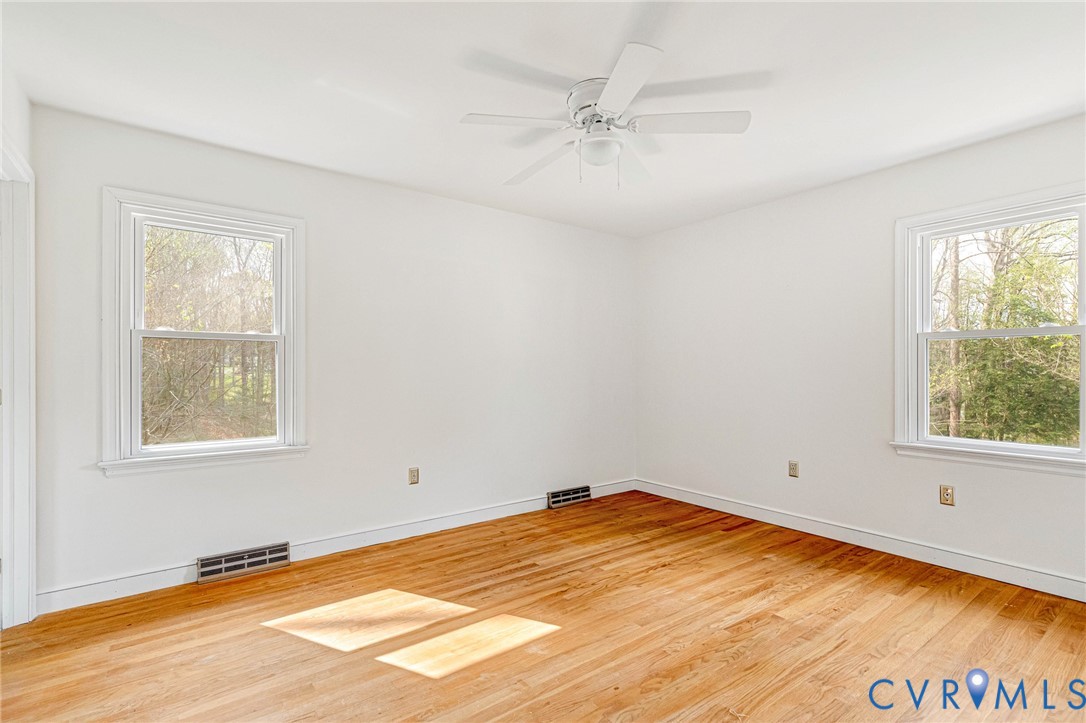 9107 Mossy Brook Road Mechanicsville, VA 23116 - Photo 14 of 30 Empty room with light wood-style flooring and ceil