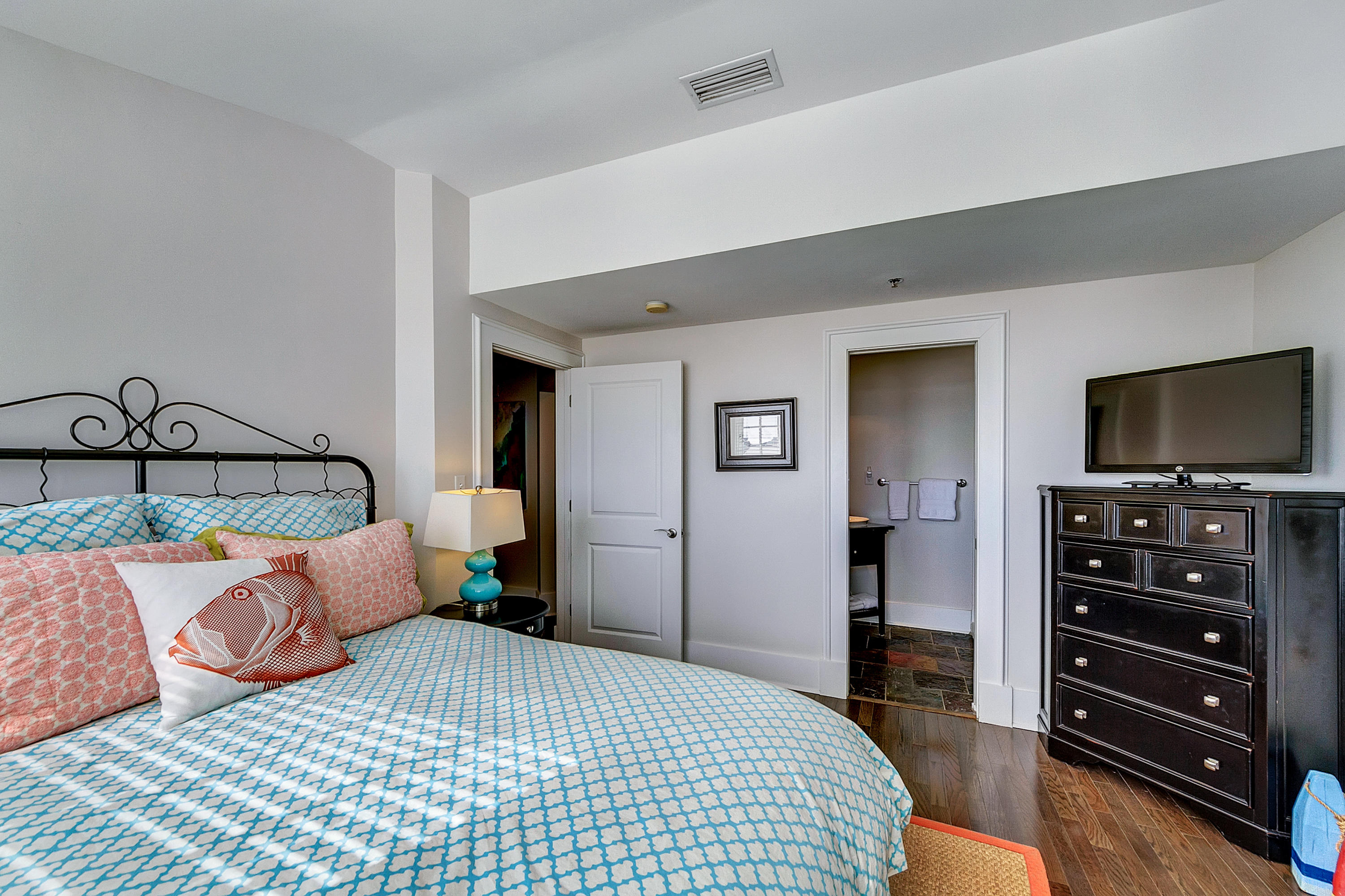 5 Main Street, Unit 1F Rosemary Beach, FL 32461 - Photo 17 of 24 a bedroom with a bed and a flat screen tv