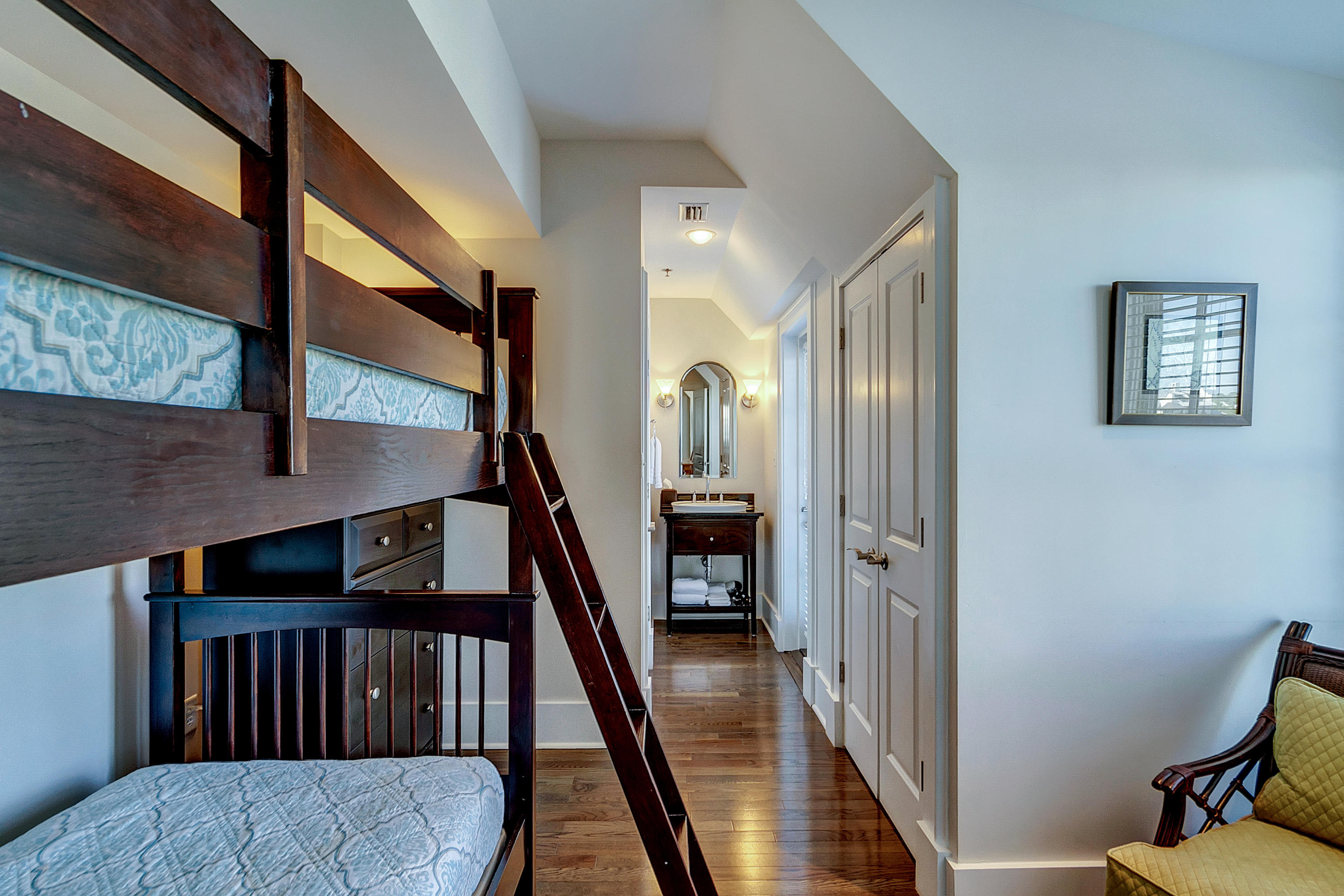 5 Main Street, Unit 1F Rosemary Beach, FL 32461 - Photo 20 of 24 a view of staircase with lots of frames and wooden floor