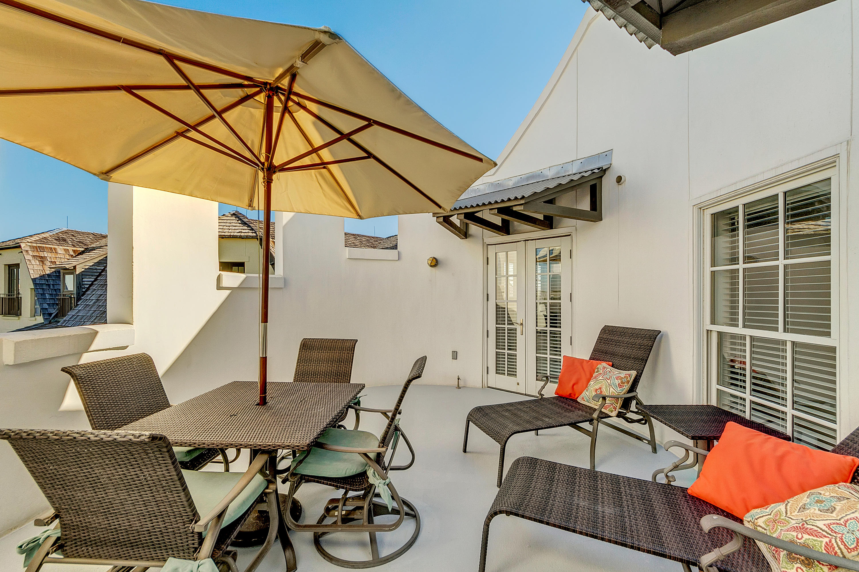 5 Main Street, Unit 1F Rosemary Beach, FL 32461 - Photo 2 of 24 a patio with a table and chairs