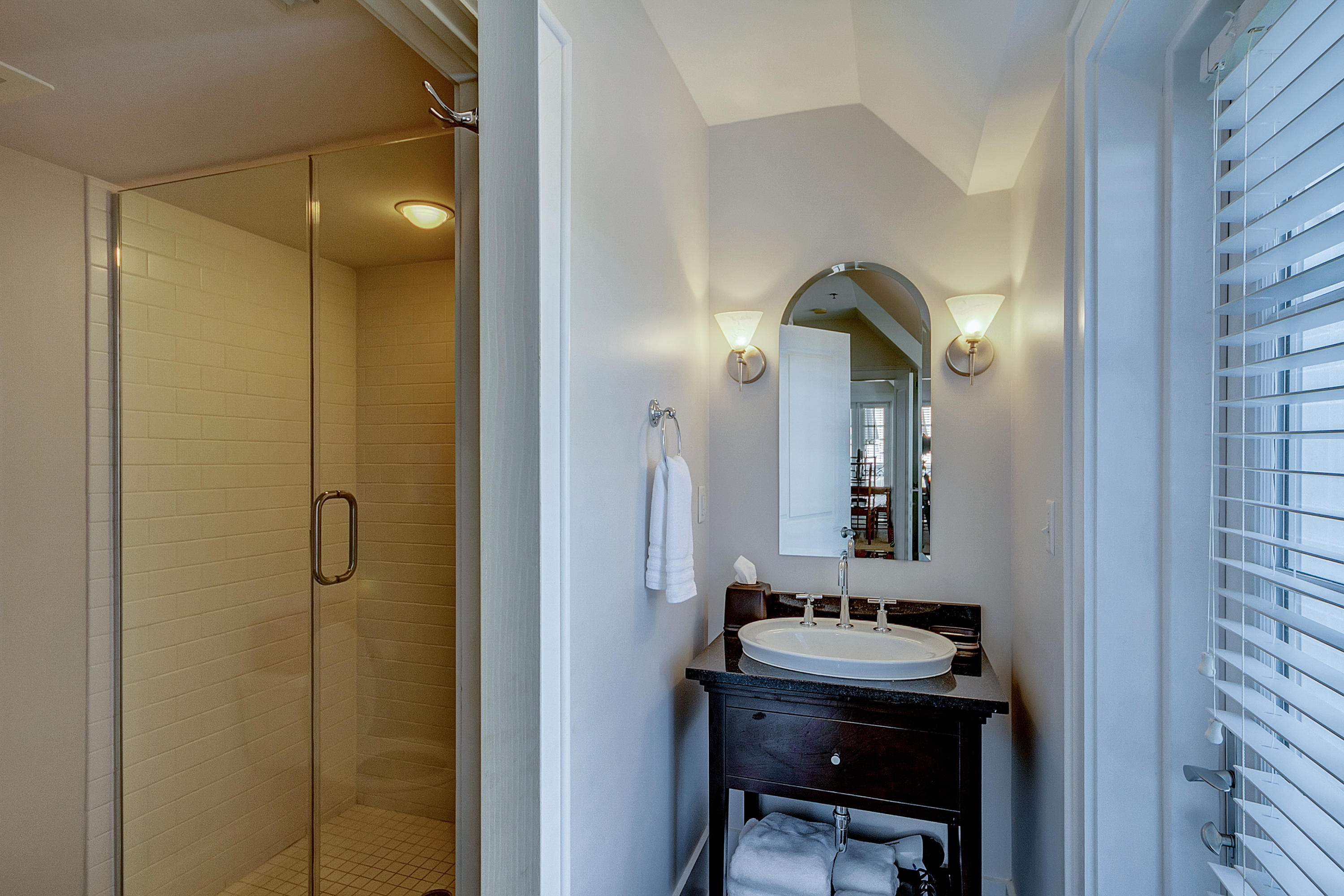 5 Main Street, Unit 1F Rosemary Beach, FL 32461 - Photo 22 of 24 a bathroom with a sink a light fixture and a mirror