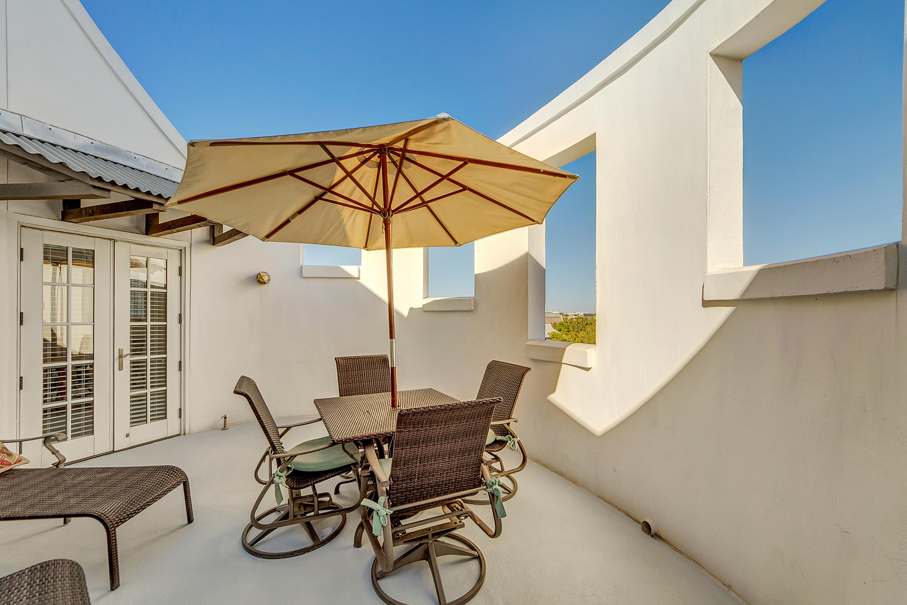 5 Main Street, Unit 1F Rosemary Beach, FL 32461 - Photo 3 of 24 a view of balcony with furniture and umbrella