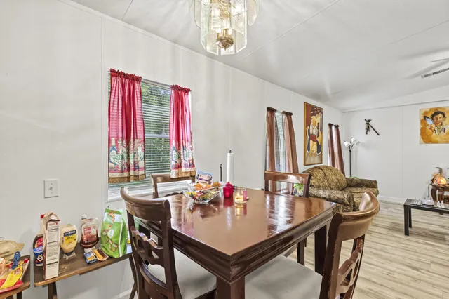 a view of a dining room with furniture window and outside view