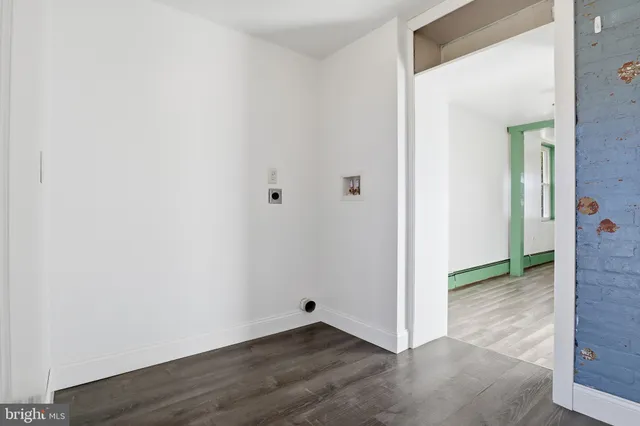 a view of a hallway with front door