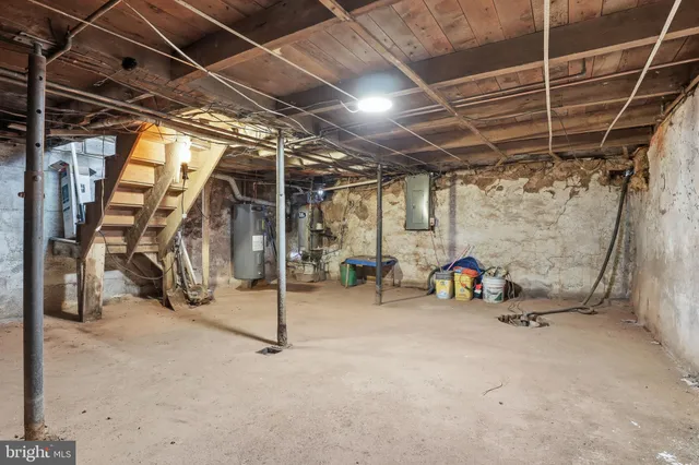 a view of empty room with wooden walls
