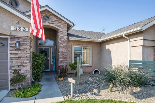 a front view of a house with garden