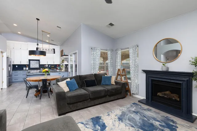 a living room with furniture and a fireplace