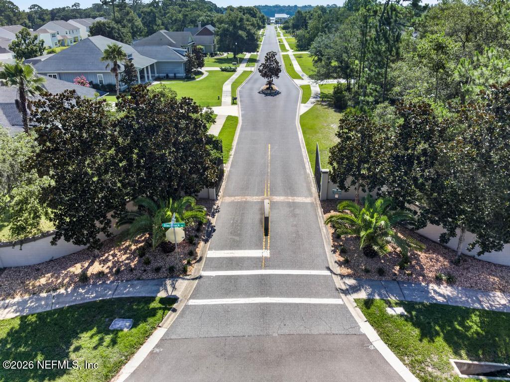 96022 Captains Pointe Road Yulee, FL 32097 - Photo 2 of 19 a view of a swimming pool with a garden and plants