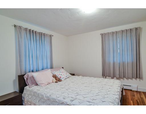 15 Hadley Road Framingham, MA 01701 - Photo 13 of 26 a bedroom with a bed and a window