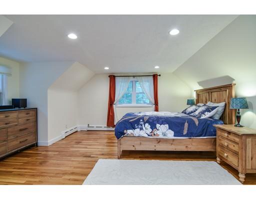 15 Hadley Road Framingham, MA 01701 - Photo 15 of 26 a bedroom with a large bed and a dresser
