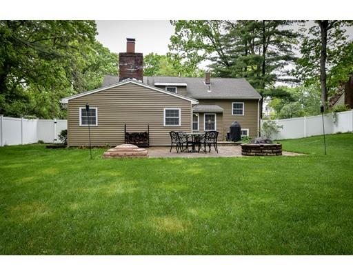 15 Hadley Road Framingham, MA 01701 - Photo 24 of 26 a backyard of a house with table and chairs