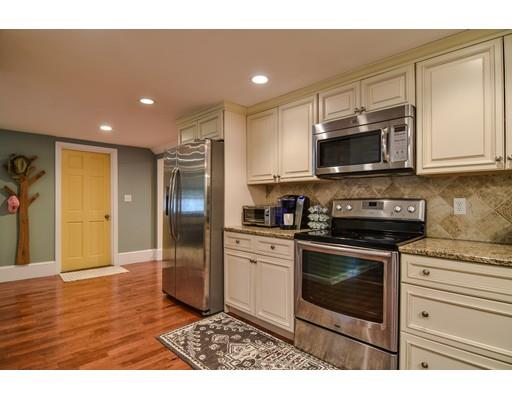 15 Hadley Road Framingham, MA 01701 - Photo 10 of 26 a kitchen with stainless steel appliances granite countertop a stove a sink and a refrigerator